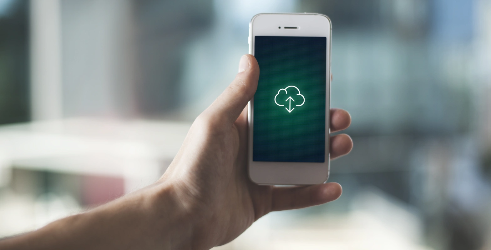 shallow focus shot hand holding smartphone